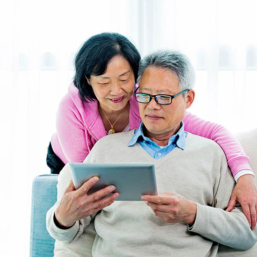 Funeral Planning Elderly couple looking at tablet online