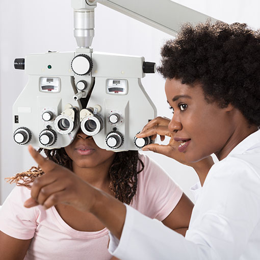 Vision Insurance Eye doctor performing eye exam